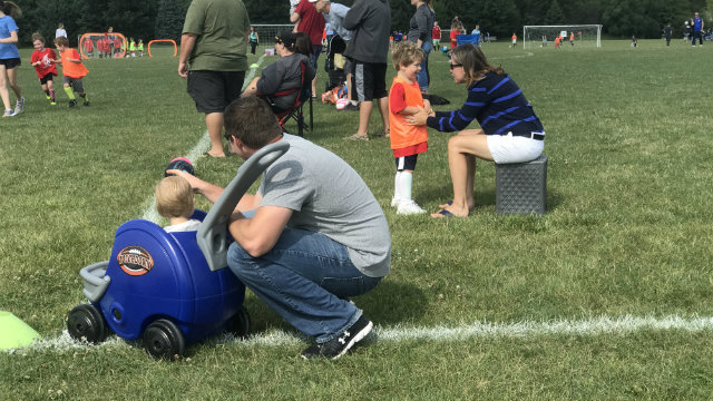 Kids playing soccer outside