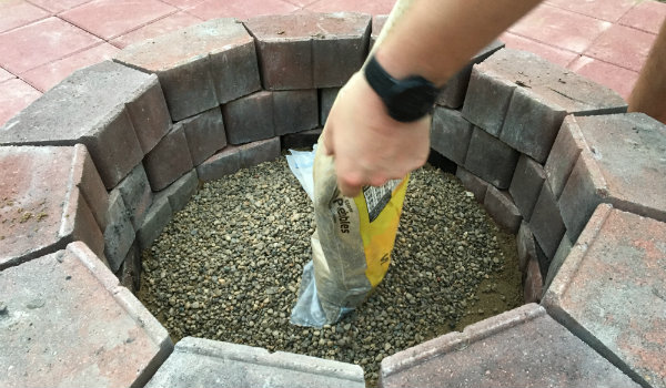 Spread gravel on top of the paver sand